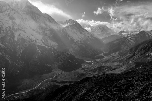 Black and white misty mountains. Marsyangdi mountain river valley. Morning in Himalayas, Nepal, Annapurna conservation area