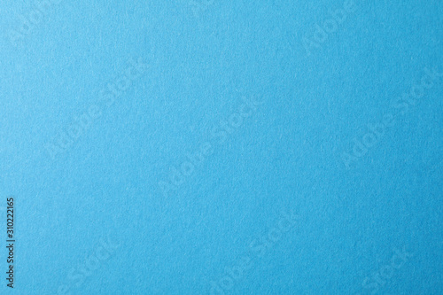 Blue textured sheet background. Empty space for text