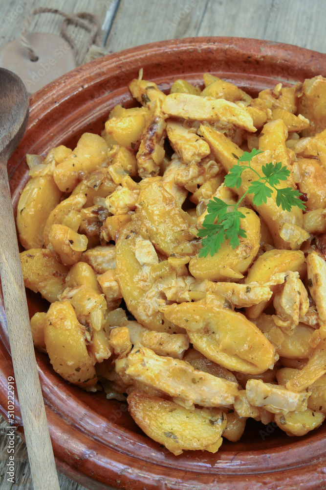 fried potatoes and chicken on a table fried potatoes and chicken on a table