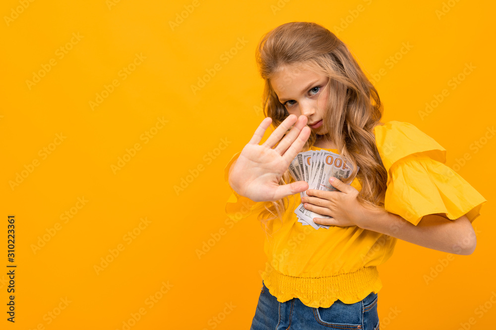 Nice little girl with a lot of money isolated on white background Nice little girl with a lot of money isolated on white background
