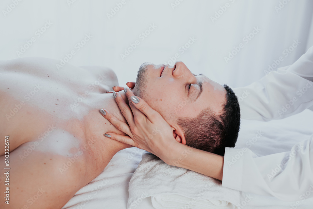 doctor cosmetologist doing facial massage men spa treatments doctor cosmetologist doing facial massage men spa treatments