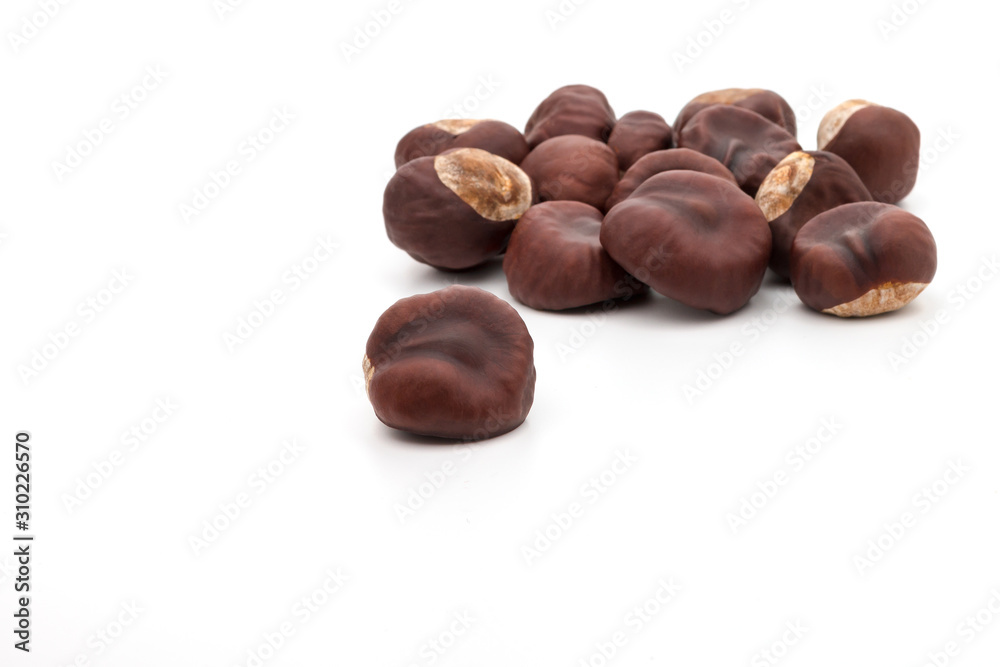 a group of dried chestnuts resembling hearts on a white background a group of dried chestnuts resembling hearts on a white background