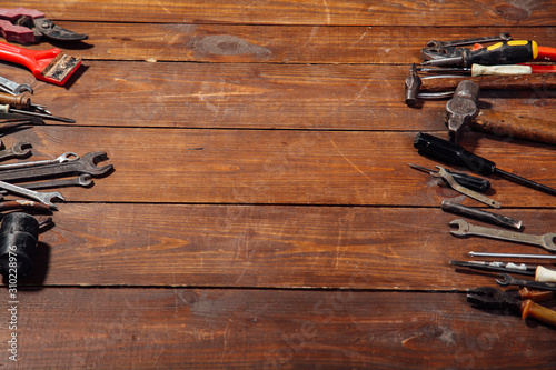 construction hammers screwdriver repair tool pliers on the boards