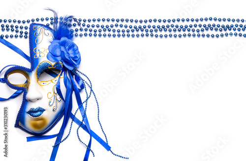 the beads are lined in even rows and the Mardi Gras mask is blue on a white background photo