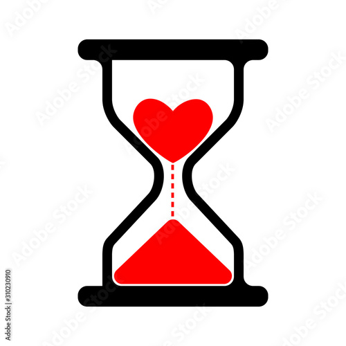 Conceptual sand glass clock filled with red sand in the shape of a heart. Love concept