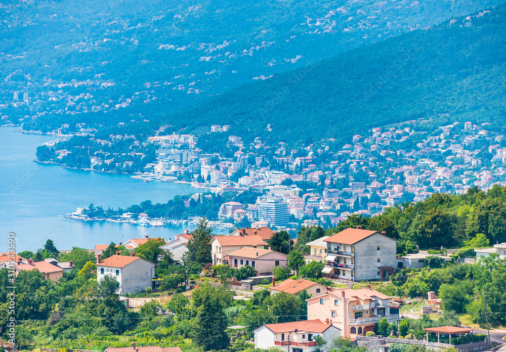 Opatija city in Croatia view from above with blue water of Kvarner bay on a sunny day