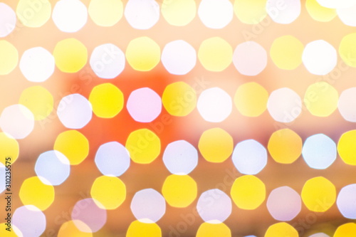Blurred yellow and white Bokeh lights in the party as the abstract texture and background, Bokeh glitter color lights