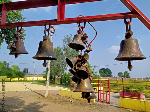 Set of Temple Bells in a temple with sky background and nature photo