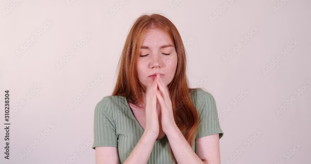 Scared beautiful young woman on light grey background Scared beautiful young woman on light grey background