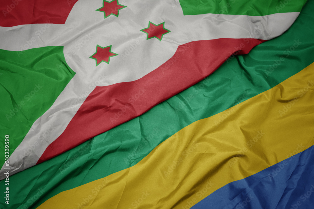 waving colorful flag of gabon and national flag of burundi . waving colorful flag of gabon and national flag of burundi .