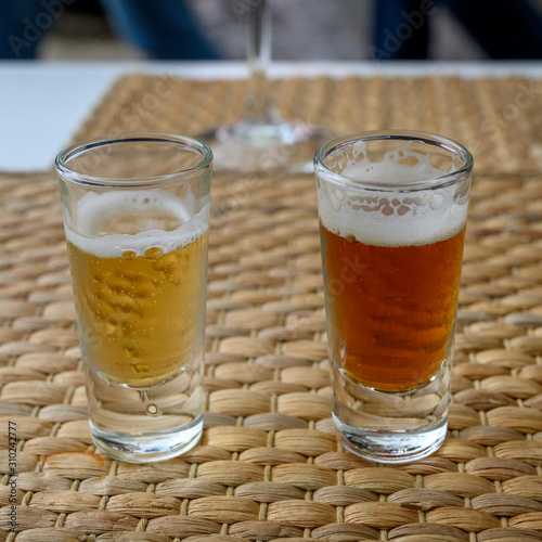 Close-up of two glasses of beer, Sao Cristovao e Sao Lourenco, Lisbon, Portugal photo