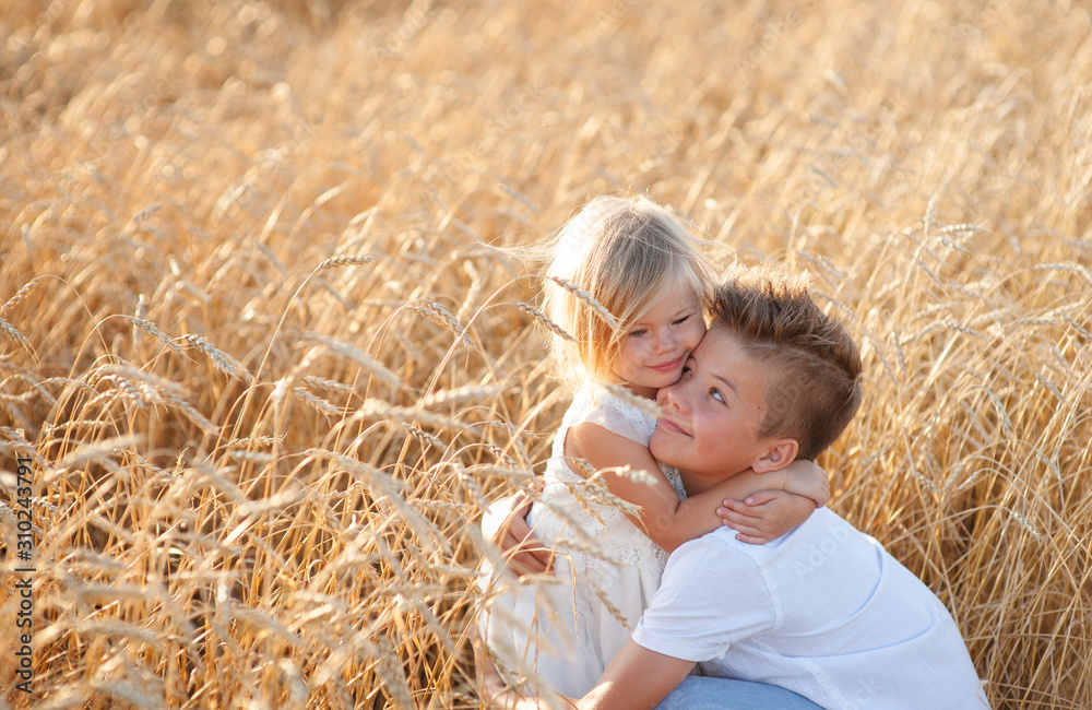 boy and girl hugging in wheat field boy and girl hugging in wheat field