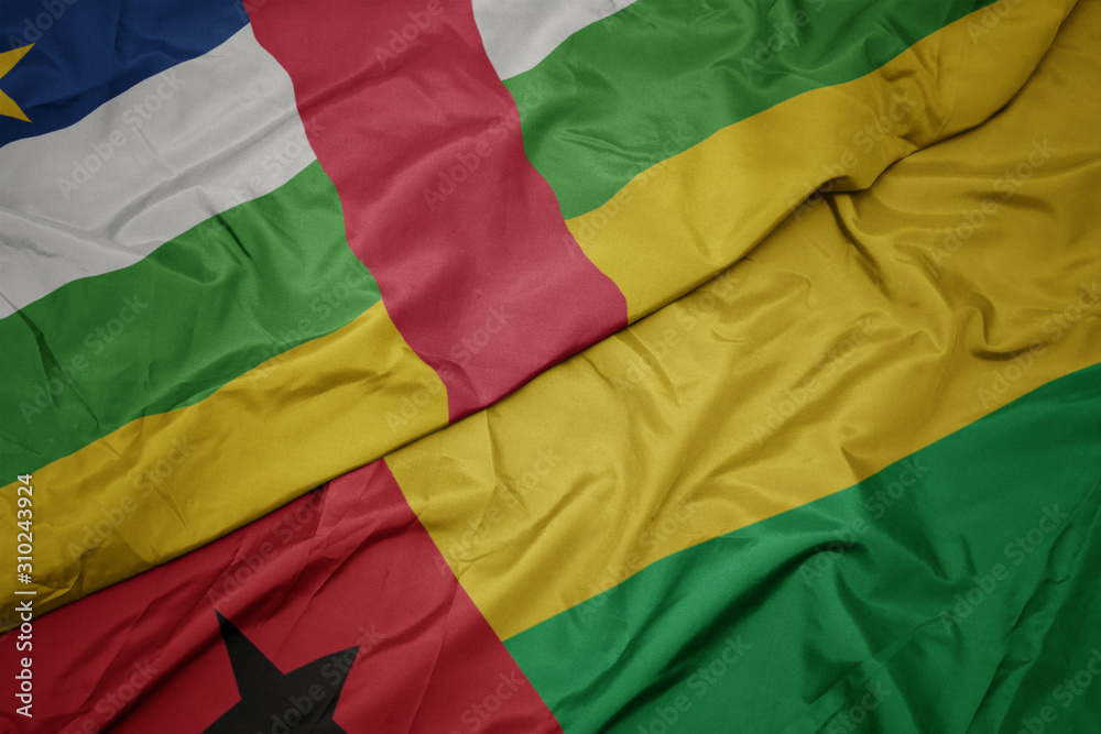 waving colorful flag of guinea bissau and national flag of central african republic.