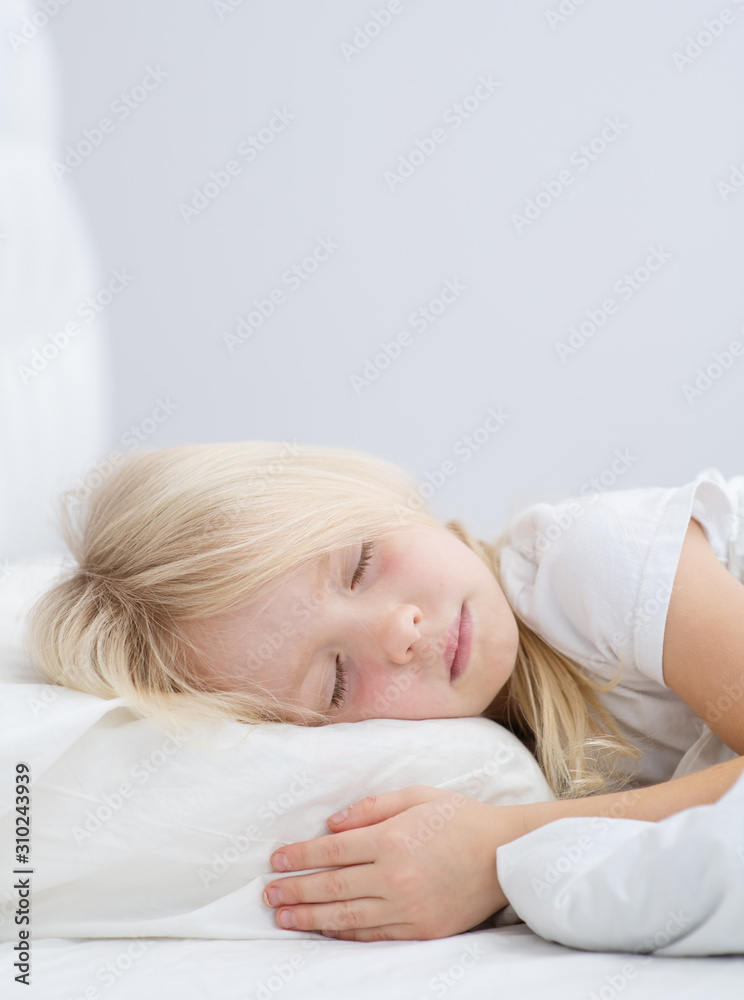 little girl sleeping on the bed in the bedroom little girl sleeping on the bed in the bedroom