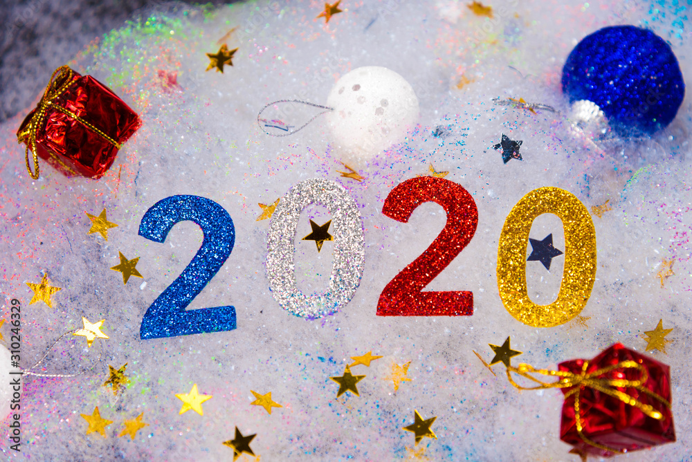 Abstract winter New Year`s and Christmas background from foam. text on foam 2020
