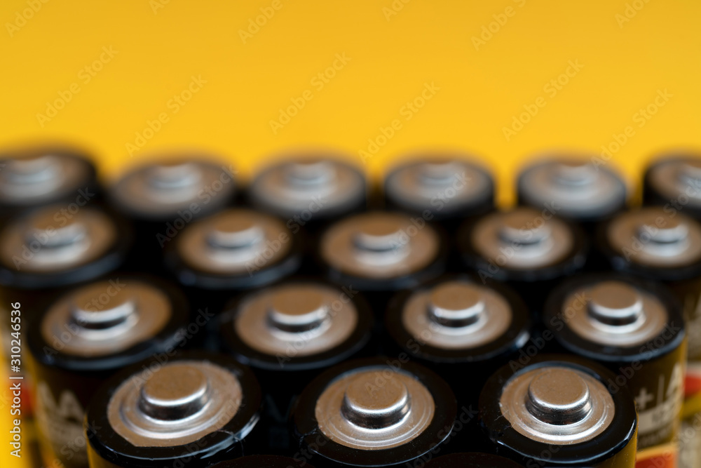 Used batteries are arranged in a triangle shape. Recycling and disposal of toxic waste. Used batteries are arranged in a triangle shape. Recycling and disposal of toxic waste.