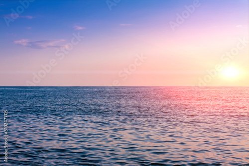 The sun sets in the sea. Use for background. © Oleg