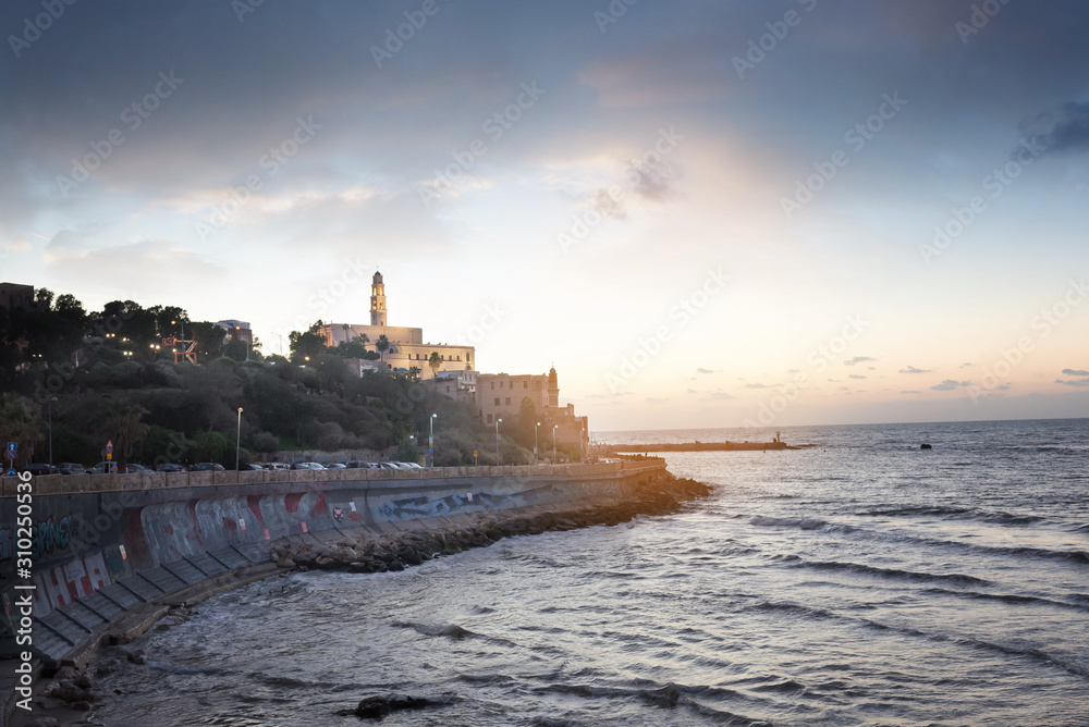 TEL AVIV, ISRAEL - waterfront and beach of old Jaffa Sunset ,cloudy