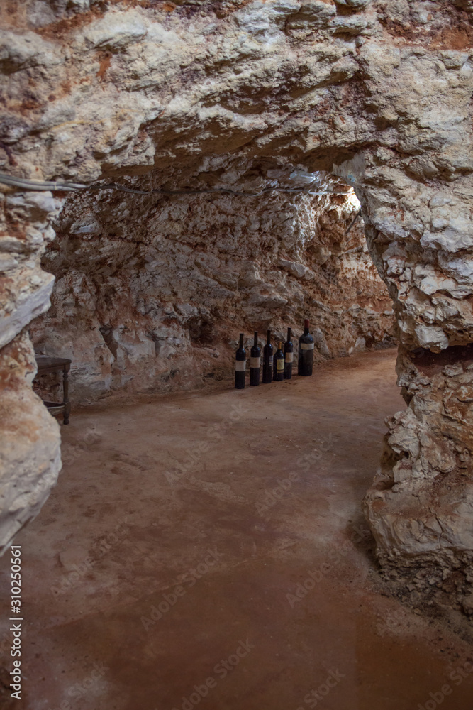 Bottles of wine on the floor of a cave Bottles of wine on the floor of a cave