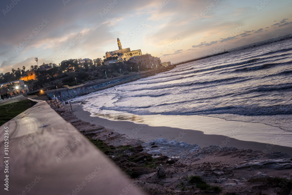 TEL AVIV, ISRAEL - waterfront and beach of old Jaffa Sunset ,cloudy