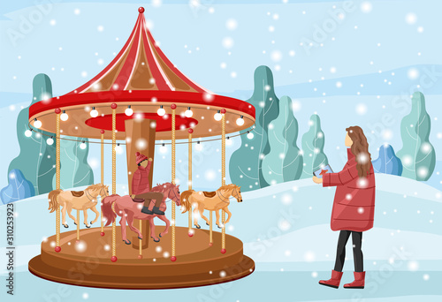 Mother having fun with her son on carnival. Forest on background. Fun christm...