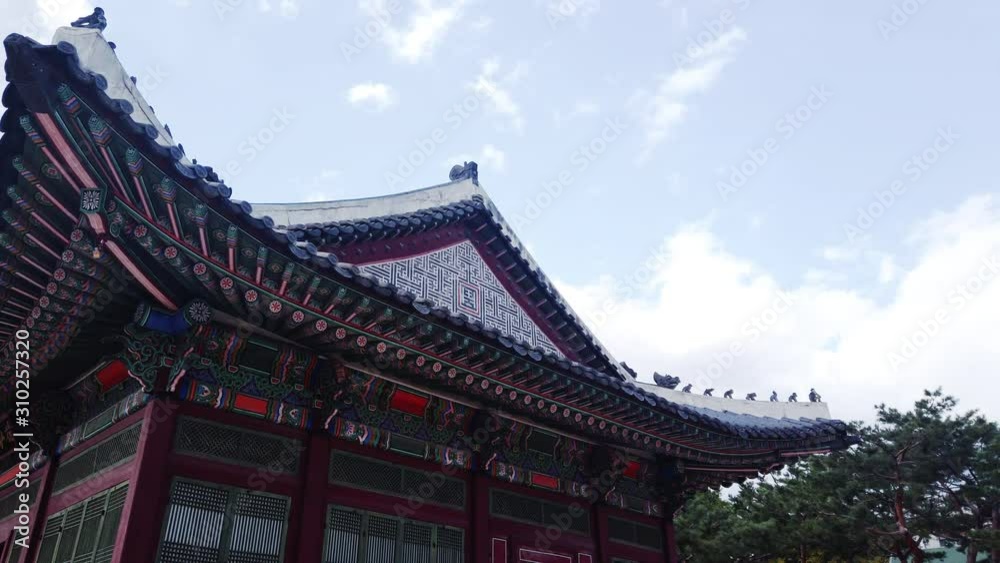 Scenic slow motion video of beautiful old building in palace in capital of Republic of Korea Seoul. Beautiful summer sunny look of construction in asian style in largest city of South Korea. Scenic slow motion video of beautiful old building in palace in capital of Republic of Korea Seoul. Beautiful summer sunny look of construction in asian style in largest city of South Korea.