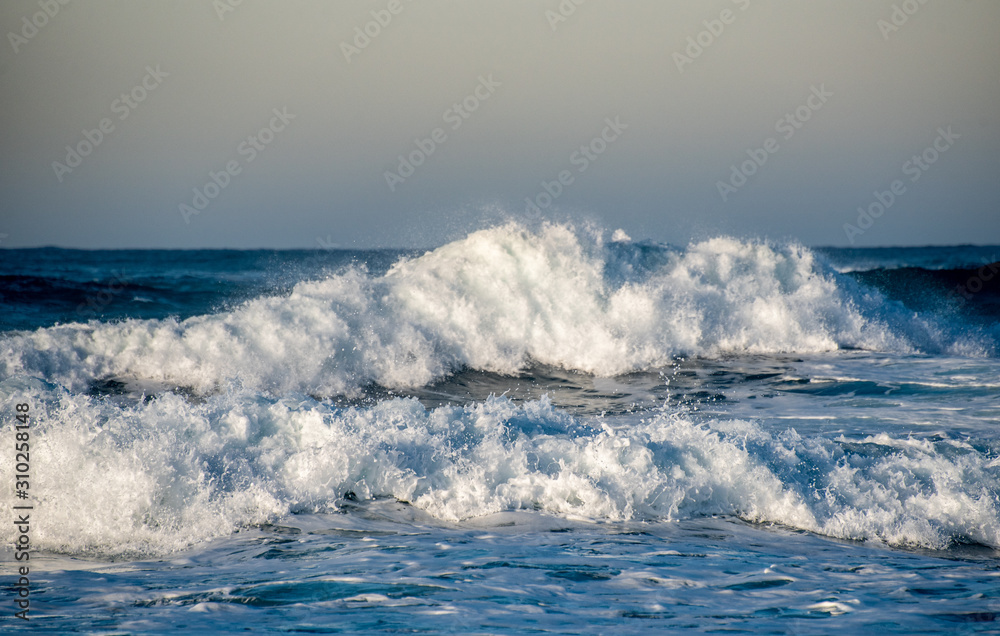Dangerous wavy ocean with wind waves crashing. Dangerous wavy ocean with wind waves crashing.