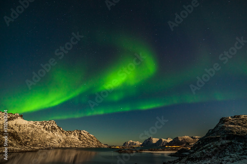 unforgettable aurora borealis, northern lights, over mountains in the North of Europe - Lofoten islands, Norway © Tatiana