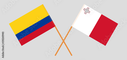 Crossed flags of Colombia and Malta photo