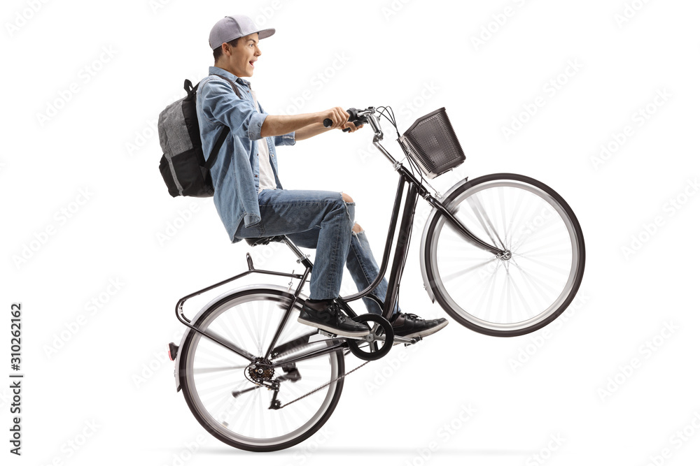 Male student riding a bicycle on one wheel