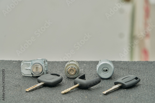 spare keys and lock cylinders ready to install in a vehicle.