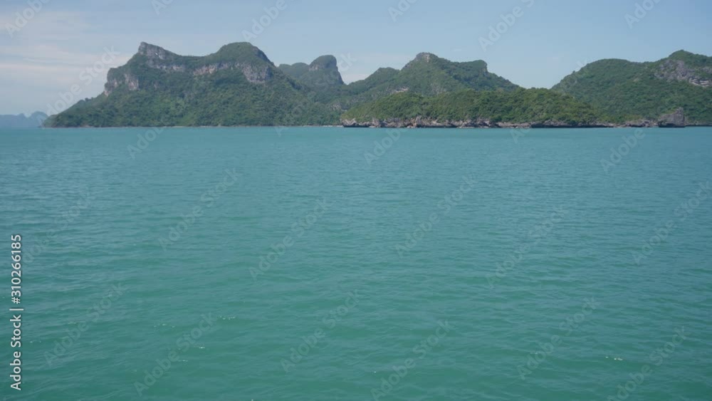 Group of Islands in ocean at Ang Thong National Marine Park near touristic Samui paradise tropical resort. Archipelago in the Gulf of Thailand. Idyllic turquoise sea natural background, copy space Group of Islands in ocean at Ang Thong National Marine Park near touristic Samui paradise tropical resort. Archipelago in the Gulf of Thailand. Idyllic turquoise sea natural background, copy space