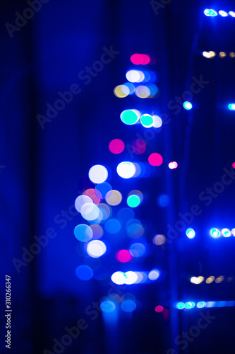 Festive colored lights.Blurred images and beautiful bokeh.Color of the year 2020 background.