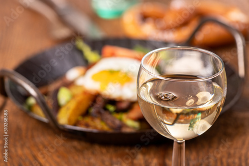 wine and tyrolean potato groestl in a pan photo