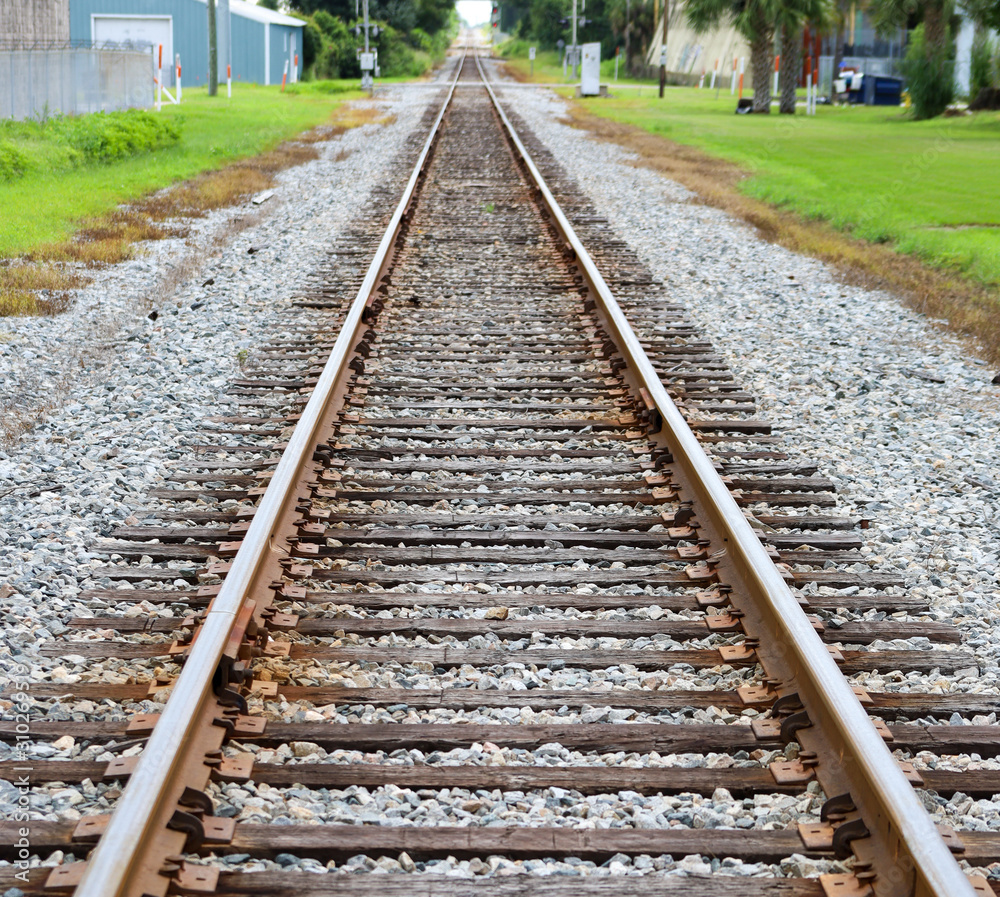 Looking down railroad tracks until the eye can't see any further. Looking down railroad tracks until the eye can't see any further.