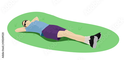 Guy lies on the grass
