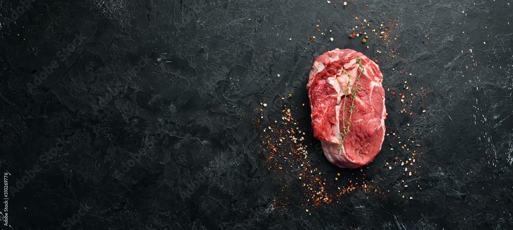 Raw marbled meat Steak Ribeye Black Angus. Top view. free space for your text. Rustic style. - obrazy, fototapety, plakaty 