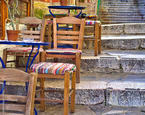 Wallpaper Mural Plaka, Athens, cafe blue tables with rustic doily cover with lace and colorful chairs with traditional textile on stone steps. Torontodigital.ca