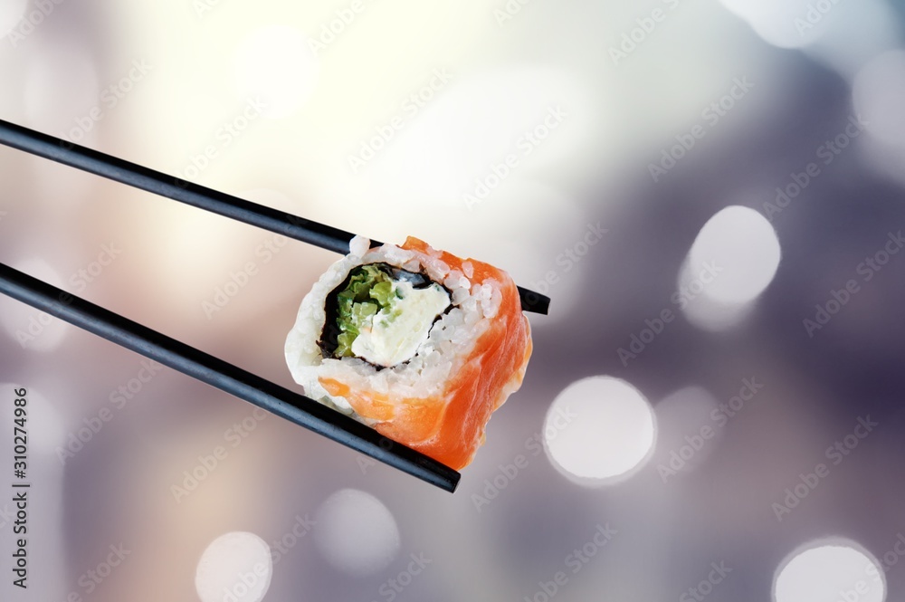 Pieces of delicious japanese sushi frozen in the air. Isolated on white background Pieces of delicious japanese sushi frozen in the air. Isolated on white background