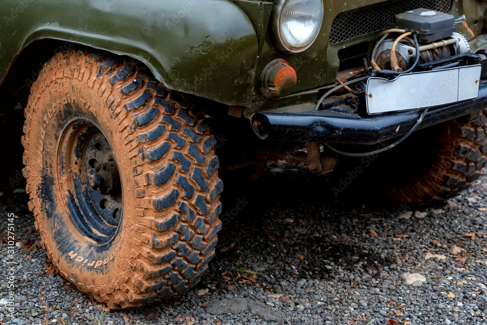 Close up image of off-road tire on ground Close up image of off-road tire on ground