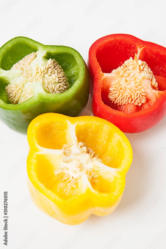 Cross section of different colored bell peppers Cross section of different colored bell peppers