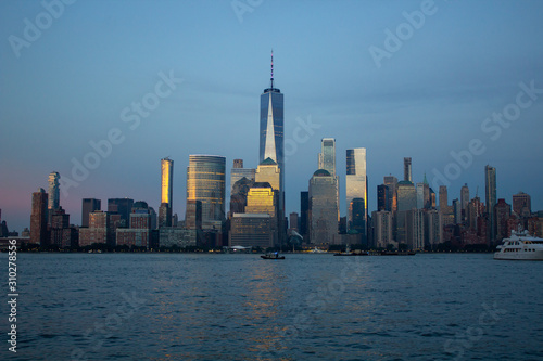 New York Skyline at sunset summer Manhattan NYC, world trade center, view from Jersey City