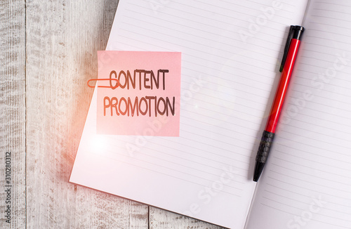 Word writing text Content Promotion. Business photo showcasing about getting content in front of the right audience Thick pages notebook stationary placed above classic look wooden backdrop