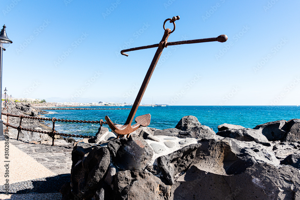 Playa Blanca resort famous winding coastal promenade along Atlantic Ocean shoreline. Lanzarote, Canaries Islands, Spain. Playa Blanca resort famous winding coastal promenade along Atlantic Ocean shoreline. Lanzarote, Canaries Islands, Spain.