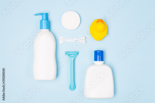 Woman bath face body care morning routine top view flat lay composition with white and blue items on light blue desk photo