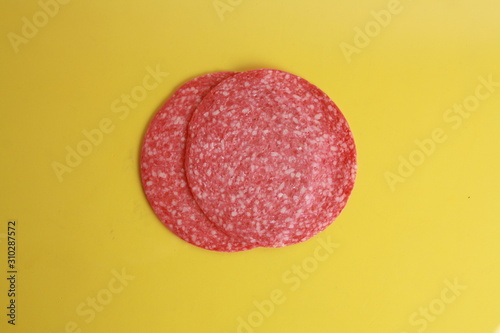 slices of salami in colorful background