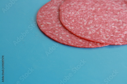 slices of salami in colorful background