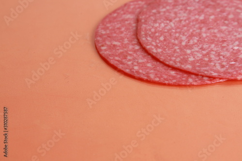 slices of salami in colorful background