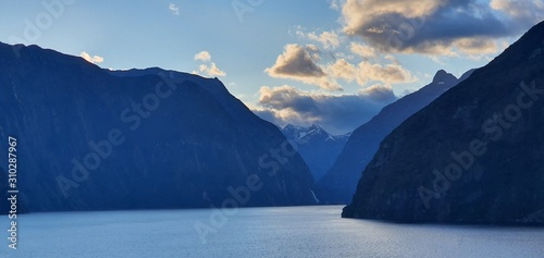 Milford Sound Fjord, Milford Sound / New Zealand - December 18, 2019: The Dramatic Mountains and Waterfalls of the Milford Sound Fjord, New Zealand photo