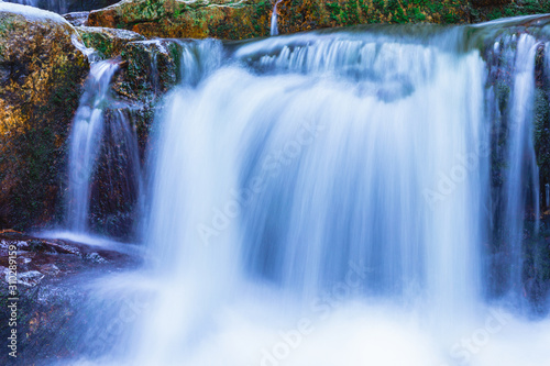 Wild Waterfall with Beautiful blur and soft flowing water by Night in Lower Silesia in Poland.